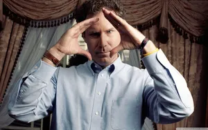 Will Ferrell Striking A Pose In A Blue Suit Wallpaper
