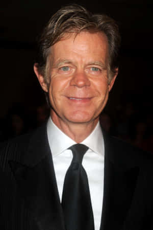 William H. Macy Posing At A Red Carpet Event Wallpaper