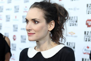 Winona Ryder Exuding Elegance In A Preppy Look. Wallpaper