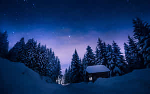 Winter Night Desktop With A Lonely Cabin Wallpaper