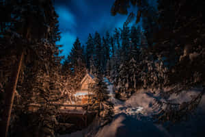 Winter Night Desktop With Cabin In The Woods Wallpaper