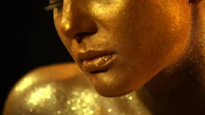 Woman Covered In Gold Dust Wallpaper