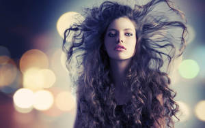 Woman Embracing Her Amazing Curly Hair Wallpaper