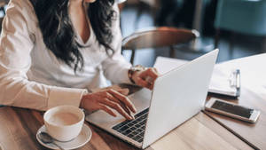 Woman Making Content At Coffee Shop Wallpaper