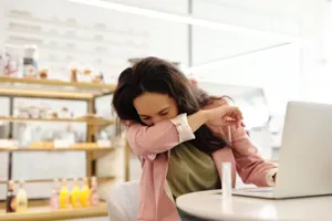 Woman Mid-sneeze Laptop Wallpaper