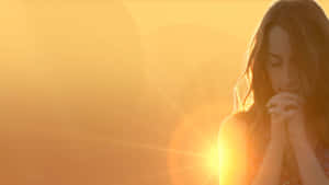 Woman Praying Golden Sunset Shot Wallpaper