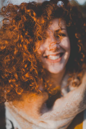 Woman With Orange Curly Hair Wallpaper