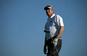 Woody Austin Holding A Golf Club Wallpaper