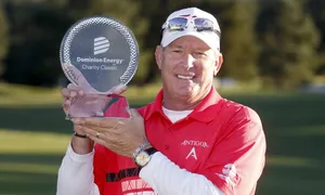 Woody Austin Holding A Trophy Wallpaper