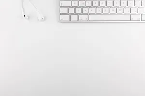 Work Table In Cute White Aesthetic Wallpaper