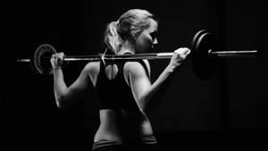 Working Out In Style - This Woman Is Pumping Iron With Confidence Wallpaper