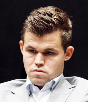World Chess Champion Magnus Carlsen In Deep Thought Wallpaper
