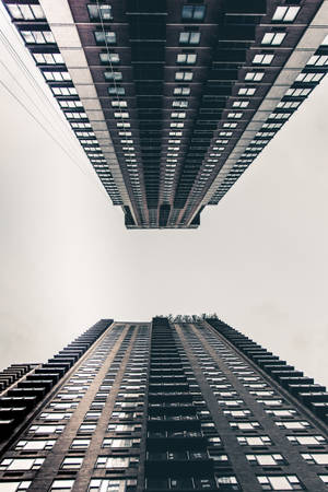 Worm's Eye View Of New York City Skyline And Buildings Wallpaper