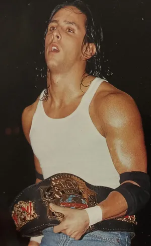 Wrestler Holding Championship Belt Wallpaper