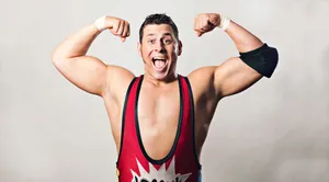 Wrestler Showing Off Muscles Wallpaper