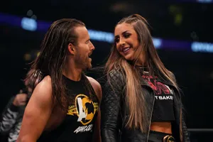 Wrestling Personality Adam Cole Posing With Britt Baker Wallpaper