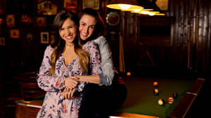 Wynonna Earp Waverly And Nicole Hugging Wallpaper