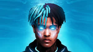Xxxtentacion Working Hard On His Laptop Wallpaper