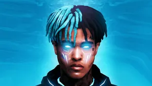 Xxxtentacion Working Hard On His Laptop Wallpaper