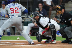 Yasmani Grandal In Action On The Baseball Field Wallpaper