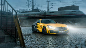 Yellow Amg Near The Train Wallpaper