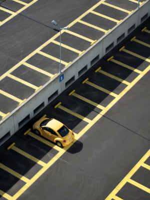 Yellow Car In Parking Lot Wallpaper