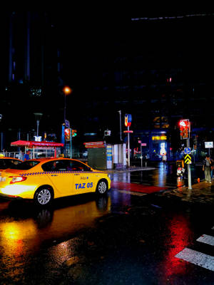 Yellow Car On Wet Road Ios 7 Wallpaper