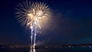Yellow Fireworks Over The Ocean Wallpaper