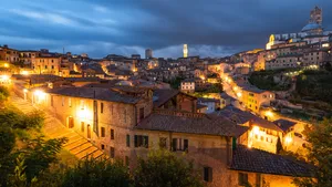 Yellow Lit Brick Houses In Siena Wallpaper
