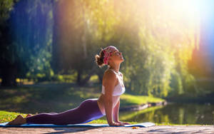 Yoga Girl Against Sunlight Wallpaper