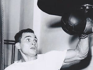 Young Carlos Ortiz Hitting Speed Bag Wallpaper