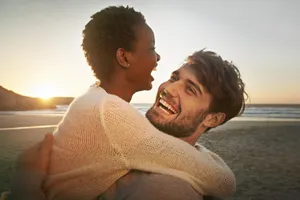 Young Couple Sharing A Romantic Moment Together Wallpaper