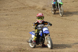 Young Racer At Motocross Racing Wallpaper