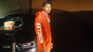 Youngboy Never Broke Again With Orange Jacket Wallpaper