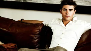 Zac Efron Reclining In Comfort Wallpaper