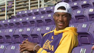 Zay Jones Seated On Stands Wallpaper